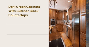 dark green cabinets with butcher block countertops